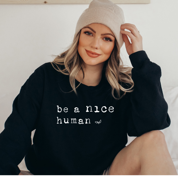 Be a nice human sweatshirt. Black with White text and decorative leaf. Lovely sweatshirt