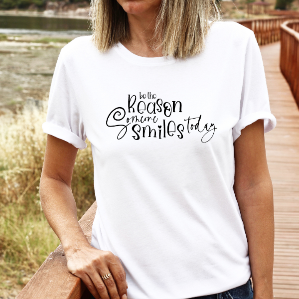 Be the reason someone smiles today  A great t-shirts with the phrase "Be the reason someone smiles today" on it.  Our Tees are soft & Comfortable to help you feel cozy and relaxed. They come in several colours and true to fit sizes. (Go up a size for a more oversized, relaxed fit)  Unisex T-shirts - suitable for men and women.  Colours available - White, Black, Indigo Blue, Military Green, Sand, Natural, Navy, Red, or Grey Tee