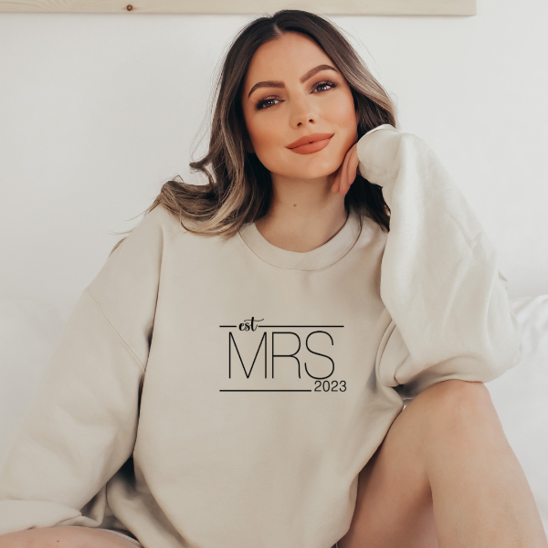 Mrs Est 2023  Crew sweatshirts  Wedding sweatshirts to celebrate your engagement and becoming a new bride. This sweatshirt is Mrs Est 2023. We have a variety of colors to choose from, so you can find the perfect one for you. 6 colours available. Poly/Cotton soft blend. Check out our other Wedding themed sweatshirts also