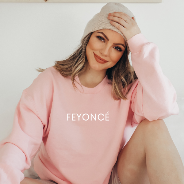Feyonce sweatshirts  This sweatshirt makes a wonderful engagement announcement or gift.  Design is available on T-shirt, sweatshirt and Hoodie  Unisex sizing for a relaxed fit. True to fit sizing. Size up for the oversized look. 6 colours - Sand, White, Black, Grey, Pink or Navy    Details • Classic Unisex fit • Sizes S - XL • 50% Cotton / 50% Polyester preshrunk fleece knit • 6 colours - Sand, White, Black, Grey, Pink, Navy