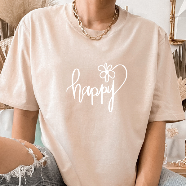 Happy T-shirt  A great good vibes t-shirts with the phrase "Happy" on it.  Our Tees are soft & Comfortable to help you feel cozy and relaxed. They come in several colours and true to fit sizes. (Go up a size for a more oversized, relaxed fit)  Unisex T-shirts - suitable for men and women.  Colours available - White, Black, Indigo Blue, Military Green, Sand, Natural, Navy, Red, or Grey Tee