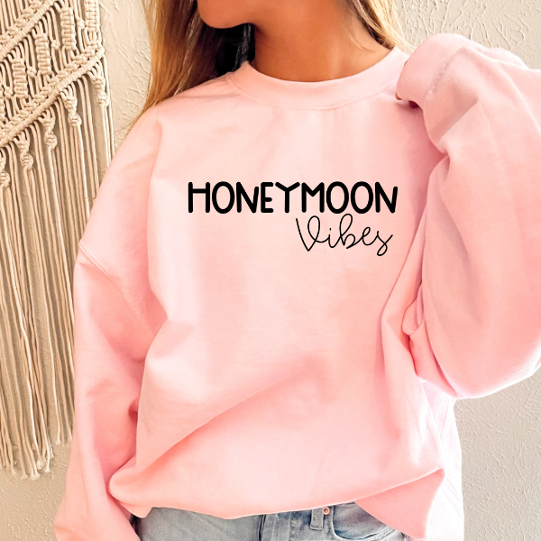 Honeymoon Vibes sweatshirts (OW)  A quality, cozy sweatshirt, printed with the special message "Honeymoon Vibes."   Design also available in T-shirts and Hoodies. Unisex sizing for relaxed fit.  6 colours - Sand, White, Black, Grey, Pink or Navy Crew neck sweatshirt