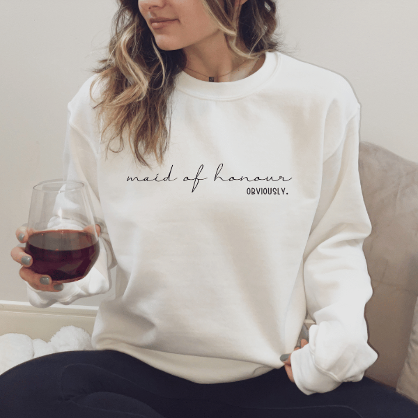 Maid of Honour obviously sweatshirts  Looking for a Bridesmaid gift? How about a quality, cozy sweatshirt, for your bridesmaid proposal printed with a special message saying "Maid of Honour -Obviously." This fantastic gift will be a special keepsake that your bridesmaid can cherish for many years to come.  Warm and cozy sweatshirts. True to fit sizing. (Size up for the oversized look). Unisex  sizing so suitable for men and women.