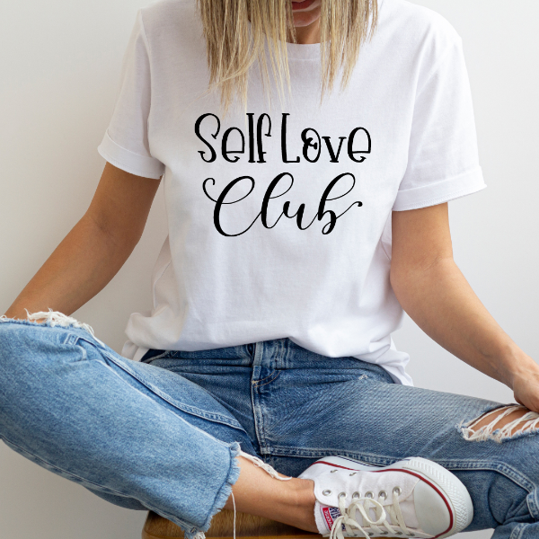 Self Love Club  Our Tees are soft & Comfortable to help you feel cozy and relaxed. They come in several colours and true to fit sizes. (Go up a size for a more oversized, relaxed fit)  Unisex T-shirts - suitable for men and women.  Colours available - White, Black, Indigo Blue, Military Green, Sand, Natural, Navy, Red, or Grey Tee