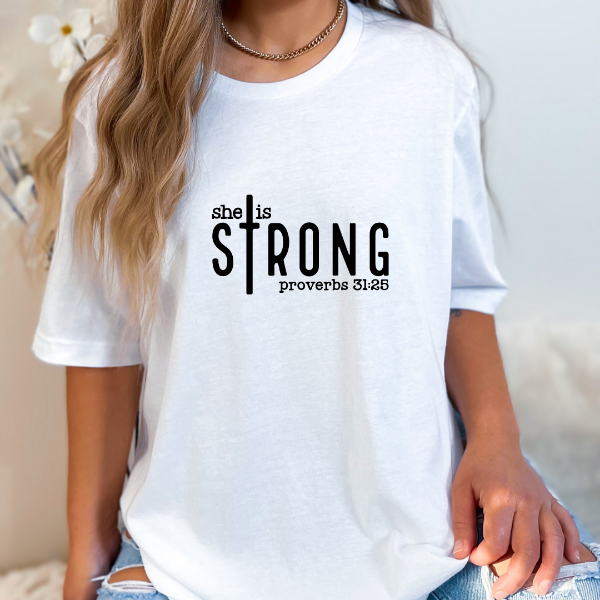 She is Strong - Proverbs 31:25  We have a great selection of t-shirts with Christian phrases and other Faith inspired messages.   Our Tees are soft & Comfortable to help you feel cozy and relaxed. They come in several colours and true to fit sizes.