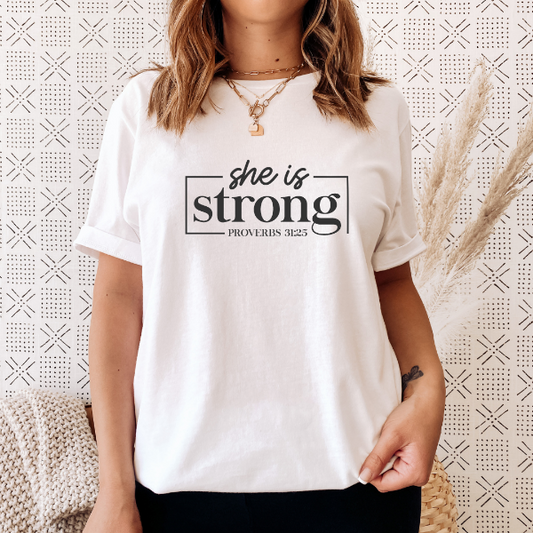 She is strong   Our Tees are soft & Comfortable to help you feel cozy and relaxed. They come in several colours and true to fit sizes. (Go up a size for a more oversized, relaxed fit)  Unisex T-shirts - suitable for men and women.  Colours available - White, Black, Indigo Blue, Military Green, Sand, Natural, Navy, Red, or Grey Tee