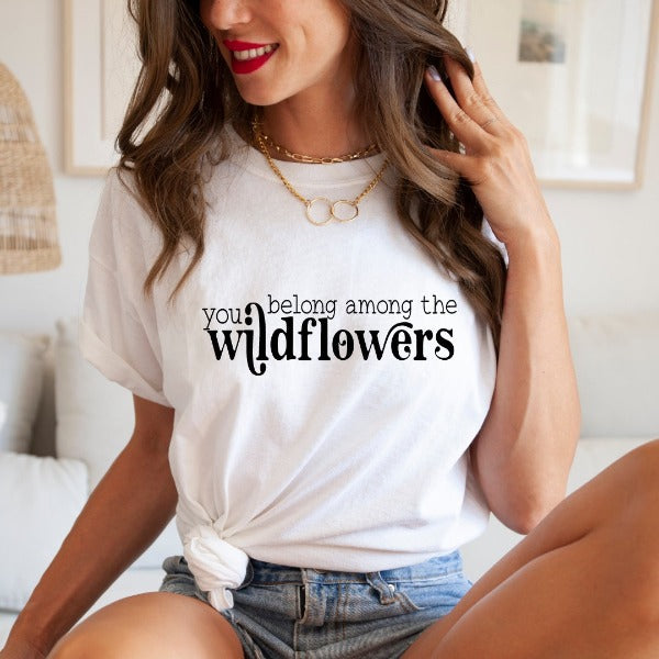 You belong among the wildflowers  A great t-shirts with the phrase "You belong among the wildflowers" on it.  Our Tees are soft & Comfortable to help you feel cozy and relaxed. They come in several colours and true to fit sizes. (Go up a size for a more oversized, relaxed fit)  Unisex T-shirts - suitable for men and women.  Colours available - White, Black, Indigo Blue, Military Green, Sand, Natural, Navy, Red, or Grey Tee