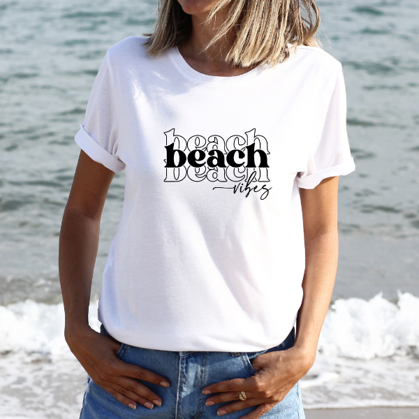 Beach Vibes  Who doesnt love the Beach!  Our Tees are soft & Comfortable to help you feel cozy and relaxed. They come in several colours and true to fit sizes. (Go up a size for a more oversized, relaxed fit)  Unisex T-shirts - suitable for men and women.  Colours available - White, Black, Indigo Blue, Military Green, Sand, Natural, Navy, Red, or Grey Tee