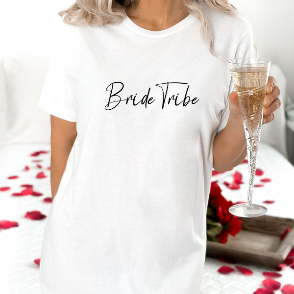 Bride Tribe T-shirt  Great wedding Party gift for the Bridal Team. Perfect for the Hens Party!  Our Tees are soft & Comfortable to help you feel cozy and relaxed. They come in several colours and true to fit sizes. (Go up a size for a more oversized, relaxed fit)  Unisex T-shirts - suitable for men and women.  Colours available - White, Black, Indigo Blue, Military Green, Sand, Natural, Navy, Red, or Grey Tee
