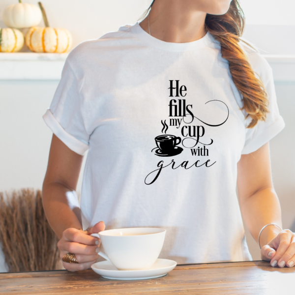 He fills my cup with grace  Our Tees are soft & Comfortable to help you feel cozy and relaxed. They come in several colours and true to fit sizes. (Go up a size for a more oversized, relaxed fit)  Unisex T-shirts - suitable for men and women.  Colours available - White, Black, Indigo Blue, Military Green, Sand, Natural, Navy, Red, or Grey Tee
