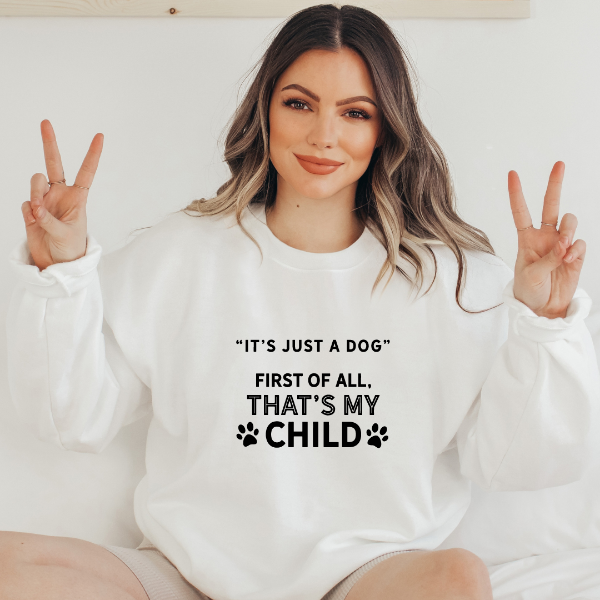Its just a dog - First of all thats my child sweatshirts A cute sweatshirt for the dog lover! Unisex sweatshirt in 6 colours - Sand, White, Black, Grey, Pink or Navy Details • Classic Unisex fit • Sizes S - XL • 50% Cotton / 50% Polyester preshrunk fleece knit • 6 colours - Sand, White, Black, Grey, Pink, Navy